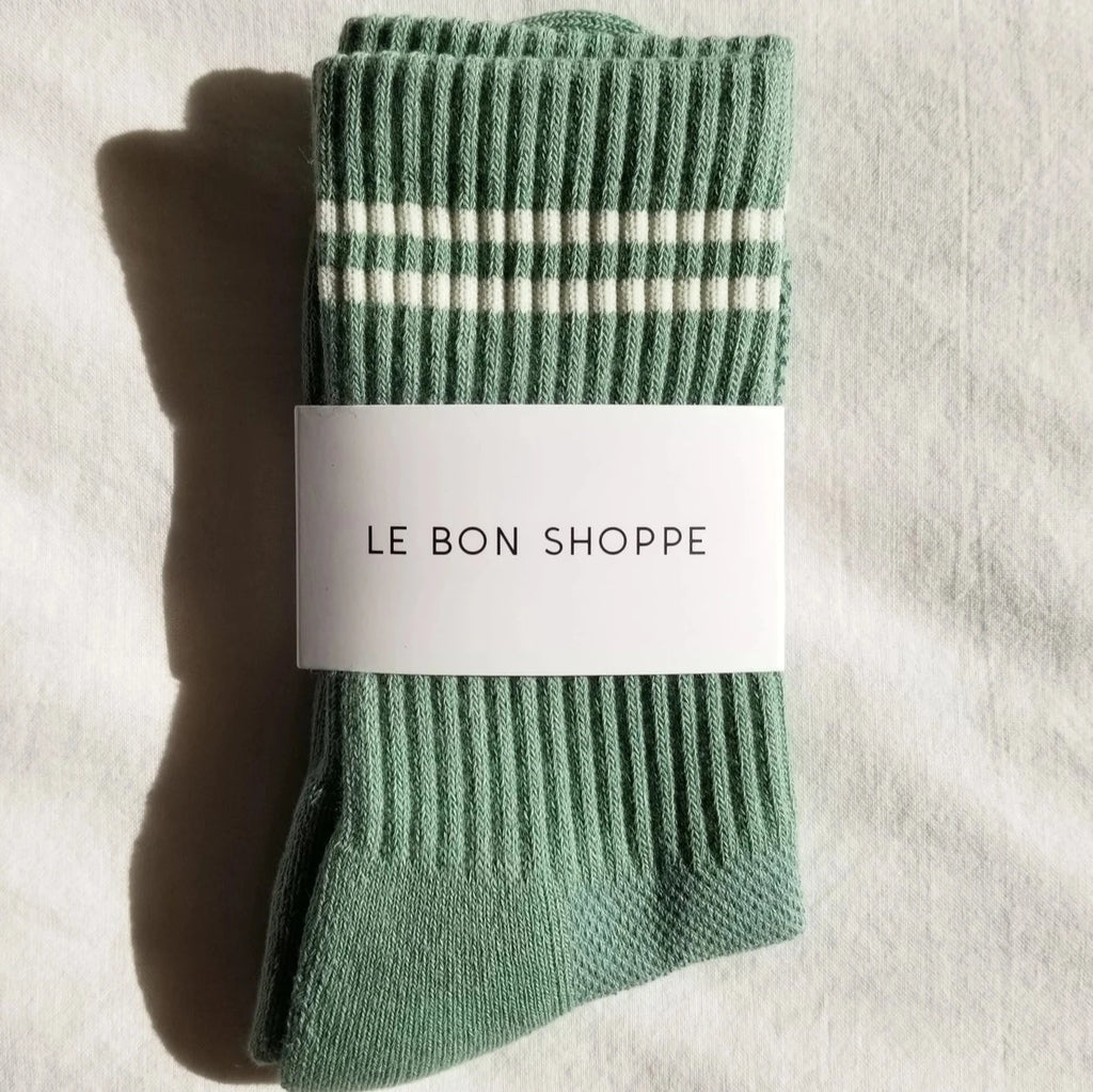 A crew length sock with a stripes at the top in moss.