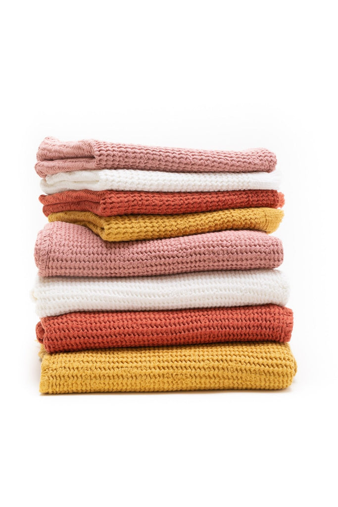 honey comb weaved hand towel in the color rose pink, white, brick red and mustard yellow